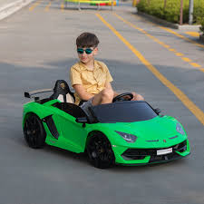 Child in a green toy car on a road
